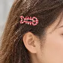Red gingham fishbone clip in brown hair-1.webp