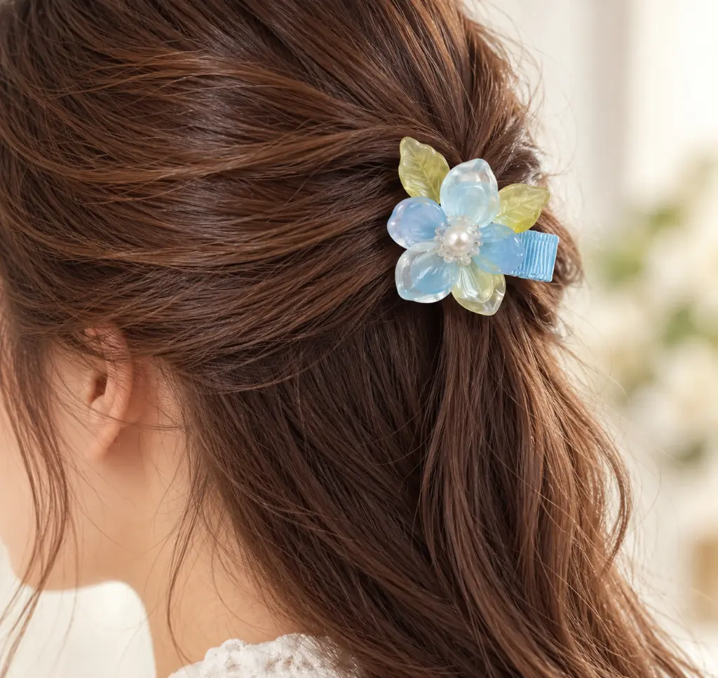 Pale blue flower hair clip in use-2.webp