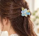 Pale blue flower hair clip in use-2.webp