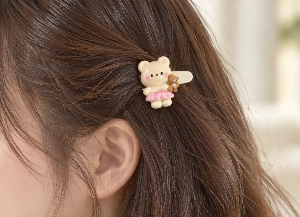 Cream bear clip in brown hair-2.webp