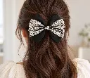 Ivory and black botanical hair bow-2.webp