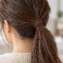 Brown fabric hair elastic securing ponytail-2.webp