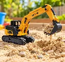 Excavadora amarilla excavando arena cinética-3.webp