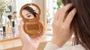 Compacto redondo con espejo y peine-2.webp