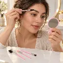 Brushing brows with a pink mirror-2.webp
