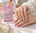 Lilac heart press-on nails at a vanity-2.webp