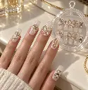Pearlescent charm nails on ivory vanity-2.webp