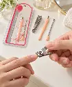 Silver Clipper Manicure Set In Use-2.webp