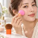 Woman using a pink kabuki brush-2.webp