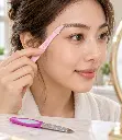 Pale pink eyebrow razor in use-2.webp